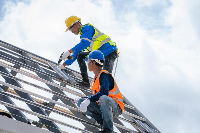 2-construction-workers-building-a-roof