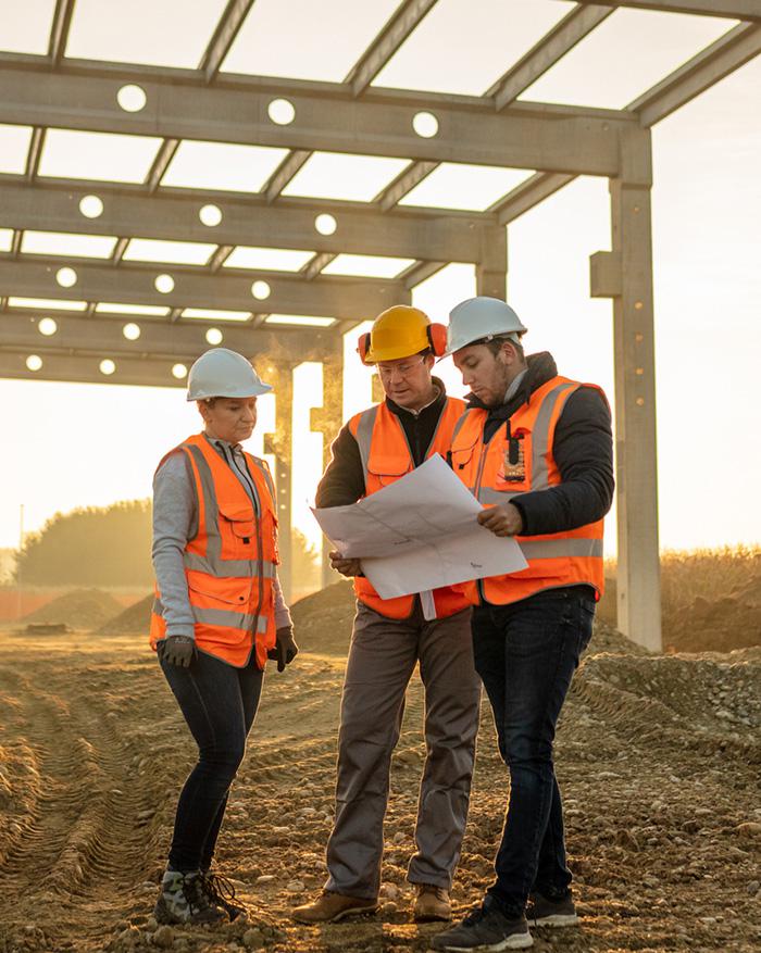 3-construction-workers-in-a-conversation